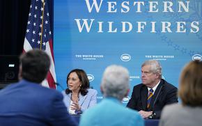 Vice President Kamala Harris, left, sitting next to Agriculture Secretary Tom Vilsack, right, speaks during an event in the South Court Auditorium on the White House complex in Washington, on June 30, 2021, with cabinet officials and governors from Western states to discuss drought and wildfires. Vice President Kamala Harris is returning to California to highlight federal wildfire programs. Harris will be in San Bernardino on Friday, Jan. 21, 2022, to spotlight federal dollars for disaster relief, including $600 million from the Forest Service for California. 