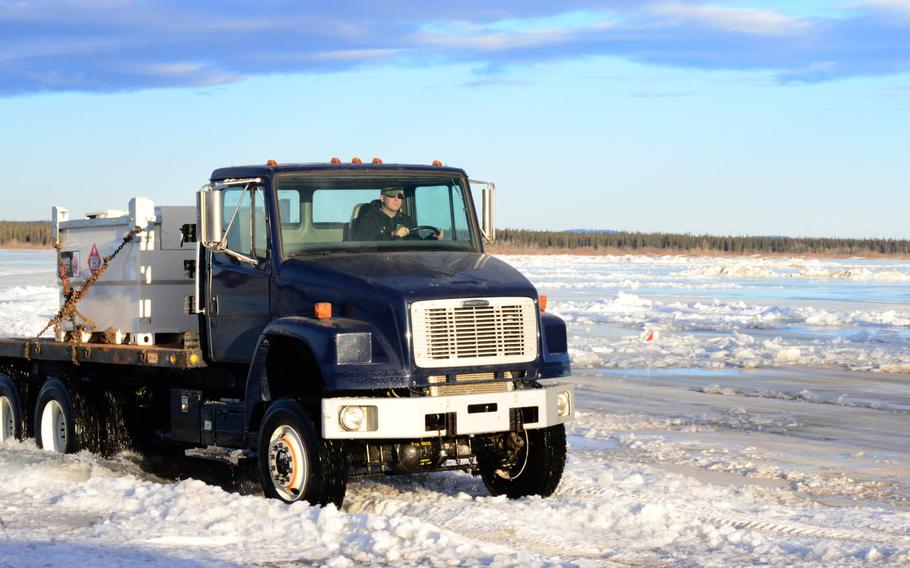 Tech. Sgt. John Jockusch, the 354th Civil Engineer Squadron noncommissioned officer in charge of range structural maintenance, drives a truck earlier this month over the ice bridge in Delta Junction, Alaska. The ice bridge is used to get to and from the Oklahoma Range, part of RED FLAG-Alaska's training area.