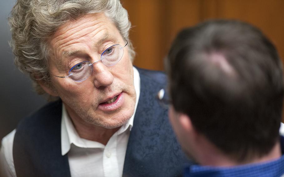 Rock legend Roger Daltrey, lead singer of The Who, speaks with Buddy Cassidy, 26, after a panel discussion hosted by the House Energy and Commerce Committee, on Wednesday, March 23, 2016, on Capitol Hill in Washington, D.C. Panelists addressed the merits of the 21st Century Cures Act which the House of Representatives passed in July but which is awaiting a vote in the Senate.