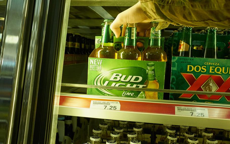 A servicemember reaches for a pack of bottled beer March 28, 2016 at Yokota Air Base, Japan. Starting April 4, U.S. Forces Japan will drop the blood alcohol concentration limit for drinking and driving on base to match Japan's legal limit. People who are caught with a blood alcohol concentration between 0.03 and 0.079 face a mandatory 60-day suspension of driving privileges.