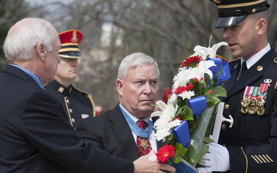 Medal of Honor recipients lay a wreath at the Tomb of the Unknown Soldier in Arlington National Cemetery during Medal of Honor Day, March 25, 2016.