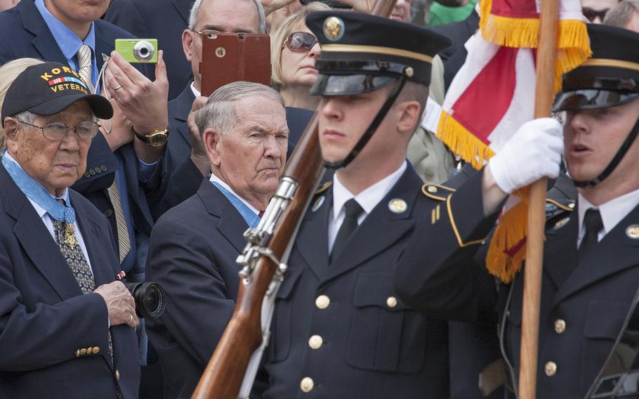 Medal of Honor recipients watch the Changing of the Guard at the Tomb of the Unknown Soldier in Arlington National Cemetery during Medal of Honor Day, March 25, 2016.