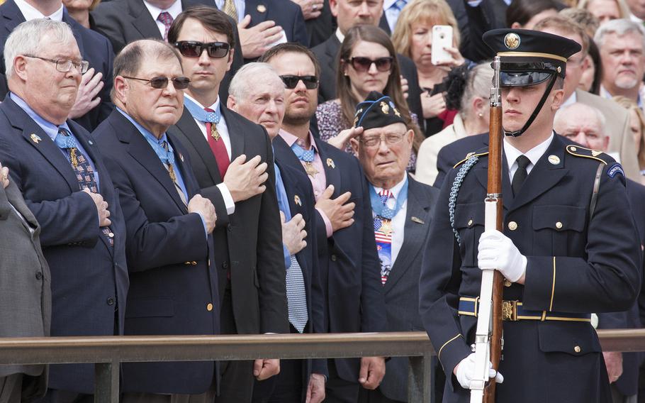 Medal of Honor recipients watch the Changing of the Guard at the Tomb of the Unknown Soldier in Arlington National Cemetery during Medal of Honor Day, March 25, 2016.