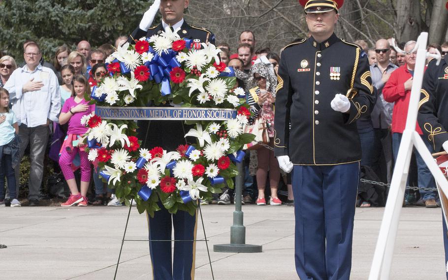Guests watch the Changing of the Guard at the Tomb of the Unknown Soldier in Arlington National Cemetery during Medal of Honor Day, March 25, 2016.