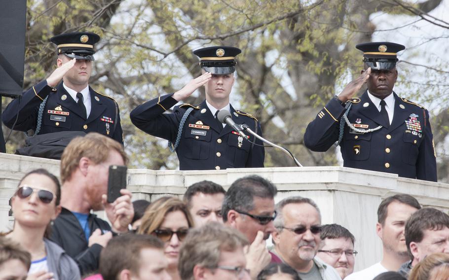 The Old Guard salutes at the Changing of the Guard at the Tomb of the Unknown Soldier in Arlington National Cemetery during Medal of Honor Day, March 25, 2016.