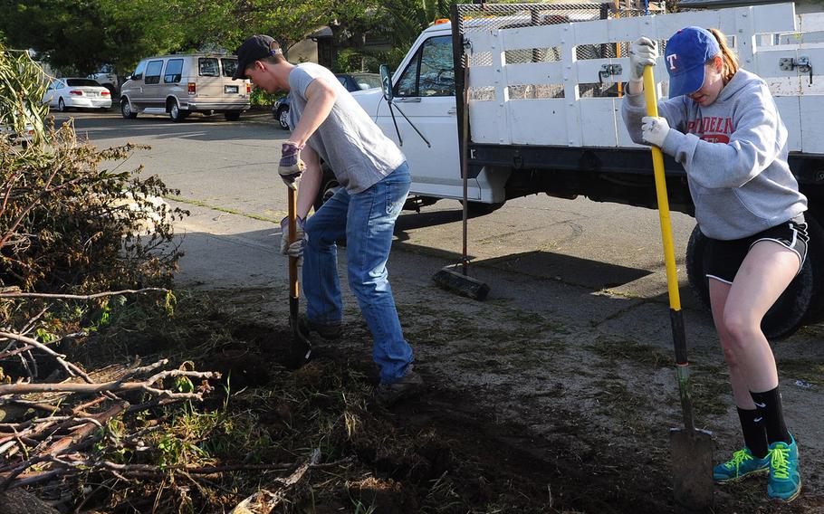 Cadet 2nd Class Anthony Mountain and Cadet 4th Class Mikaela Pollock dig at a Habitat for Humanity home site during alt-spring break.