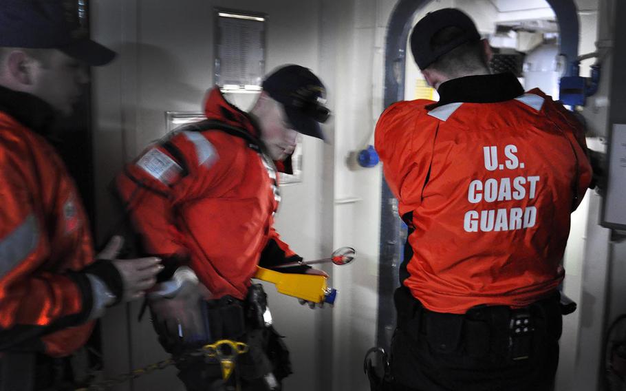 U.S. Coast Guard, Ninth District, teams from St. Ignace and Charlevoix, Mich., participate in ship boarding and clearing as part of Exercise Arctic Eagle, April 04, 2016. During the exercise, unidentified hostile forces seize a merchant ship.