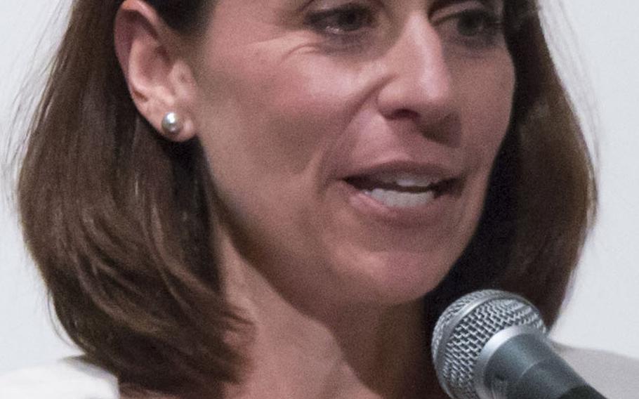 Marine Corps Lt. Col. Kate Germano speaks at a conference on military sexual assault, harassment and hazing, April 25, 2016 in Arlington, Va.