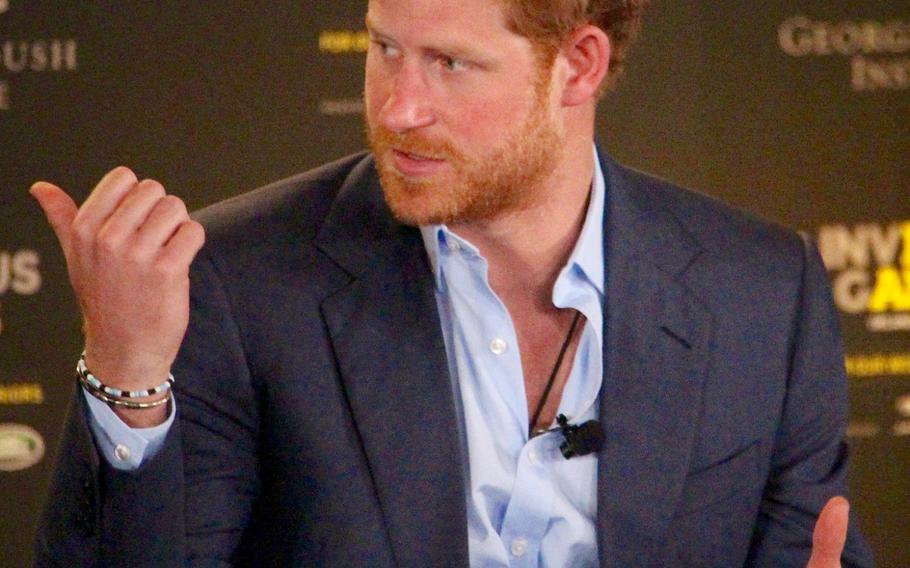 Britain's Prince Harry talks about ways to help returning servicemen who have suffered traumatic injuries on the battlefield during the 2016 Invictus Games Symposium on Invisible Wounds, Sunday, May 8, 2016 at Orlando, Fla.