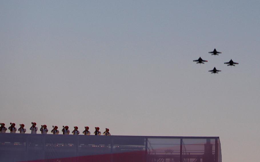 The US Navy Strike Fighter Squadron 34 fly over the crowd during the opening ceremonies of the 2016 Invictus Games at Kissimmee, Fla. on Sunday, May 8, 2016.