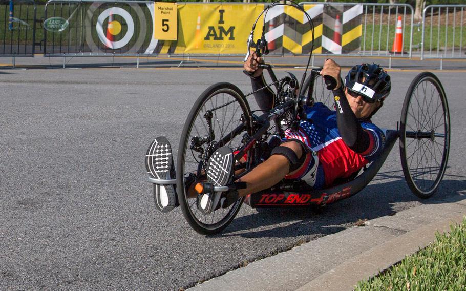A cyclist competes in the 2016 Invictus Games on a road near the ESPN Wide World of Sports Complex, Orlando, Fla., May 9.2016. The Invictus Games are an adaptive sports competition which was created by Prince Harry of the United Kingdom after he was inspired by the DoD Warrior Games. This event brings together wounded, ill, and injured service members and veterans from 15 nations for events including: archery, cycling, indoor rowing, powerlifting, sitting volleyball, swimming, track and field, wheelchair basketball, wheelchair racing, wheelchair rugby and wheelchair tennis. 115 U.S. athletes will represent the Department of Defense at Invictus Games 2016 in Orlando, Florida, May 8-12.