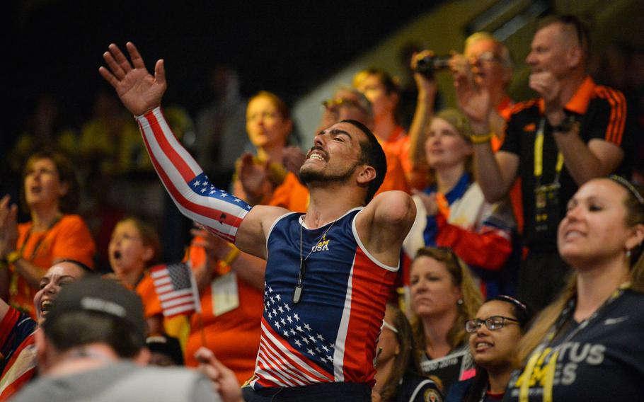 Retired U.S. Army Staff Sgt. Michael Kacer cheers on teammates at the Invictus Games 2016 rowing championships, Orlando, Fla., May 8, 2016. The Invictus Games are composed of 14 nations with over 500 military competitors competing in 10 sporting events May 8-12, 2016. 