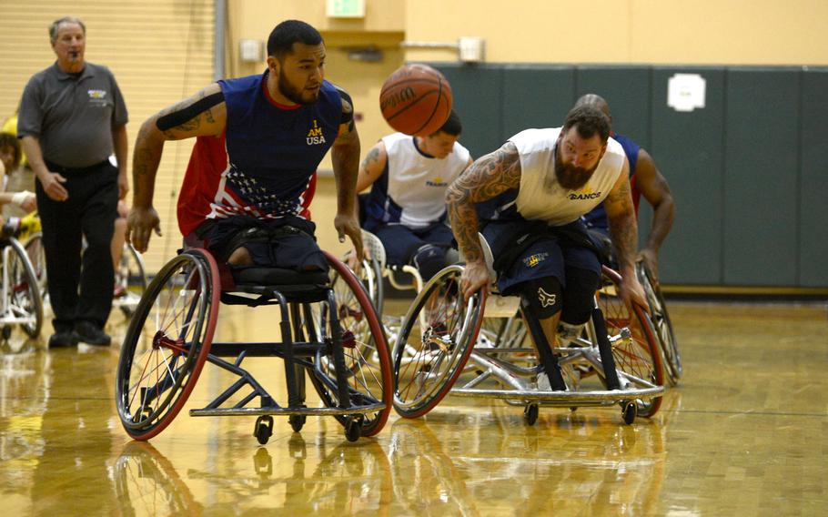 U.S. Marine Corps Cpl. Jorge Salazar, veteran, chasing the basketball during a wheelchair basketball match at the Orlando Invictus Games 2016, ESPN Wide World of Sports Complex at Walt Disney World Resort, Fla. May 6, 2016. The Invictus Games are composed of 15  nations, over 500 military competitors, competing in 10 sporting events May 8-12, 2016.