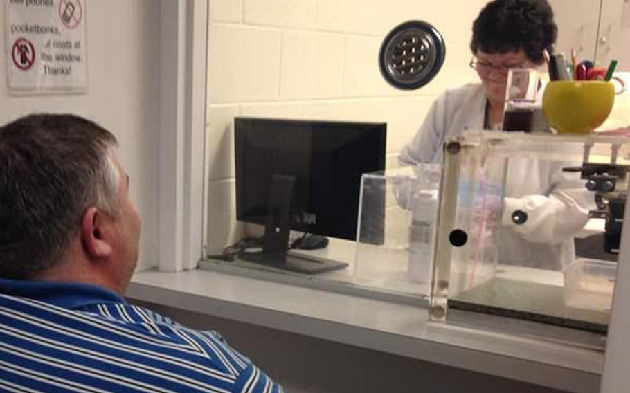 A patient gets a dose of the anti-addiction medicine buprenorphine at the Broadway Center for Addiction in Baltimore, whose treatment methods for opioid addiction are viewed as a model for other clinics.