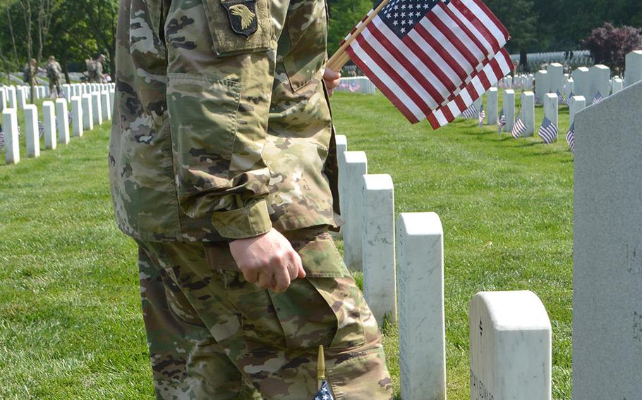 Army Chief of Staff Gen. Mark Milley takes part in Flags In at Arlington National Cemetery, May 26, 2016.