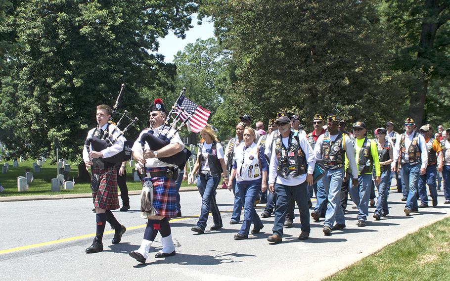 American Legion members walk from Joint Base Myer-Henderson Hall through Arlington National Cemetery for a wreath-laying ceremony at the Civil War Unknowns Monument on May 28, 2016.
