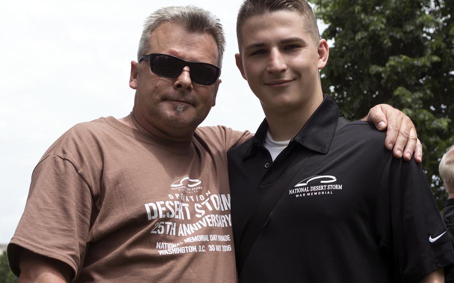 Retired U.S. Army Sgt. 1st Class Carmelo Frank Genco with his son, Anthony, on May 30, 2016, on the National Mall before the start of the Memorial Day parade. 