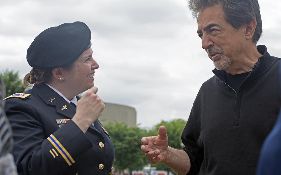 Actor Joe Mantegna chats with a servicemeber before the start of the 2016 Memorial Day Parade in Washington, D.C.