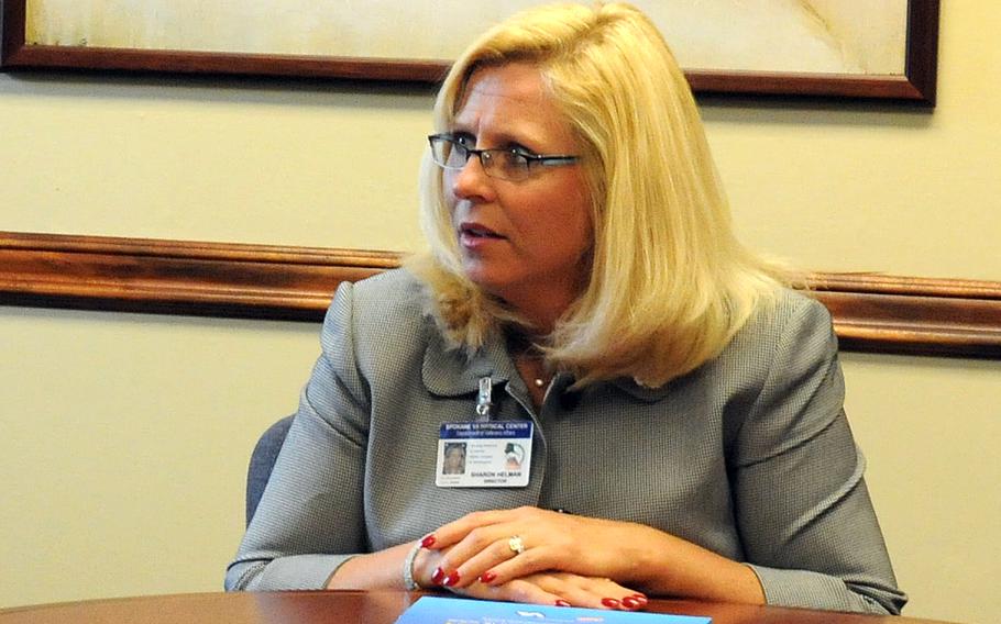 Sharon Helman, then-director of the Spokane Veterans Affairs Medical Center, is seen on May 14, 2009, attending a conference with Navy officials in Spokane, Wash. The Justice Department on Thursday, June 2, 2016, ruled that a law fast-tracking the firing of VA employees was unconstitutional.