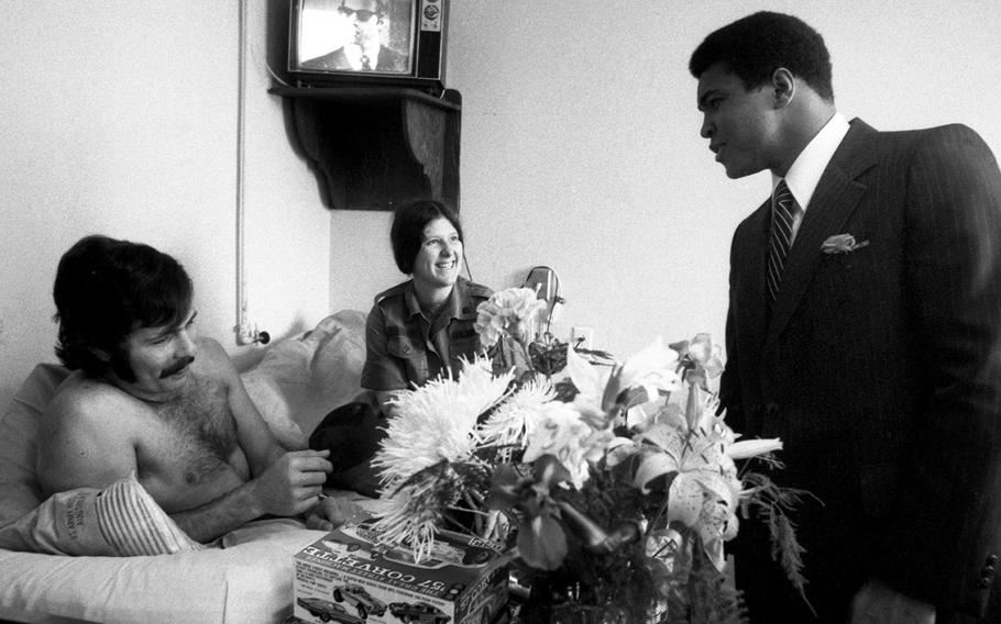 Muhammad Ali visits the hospital at Flak Casern in Augsburg, West Germany, in May, 1976.