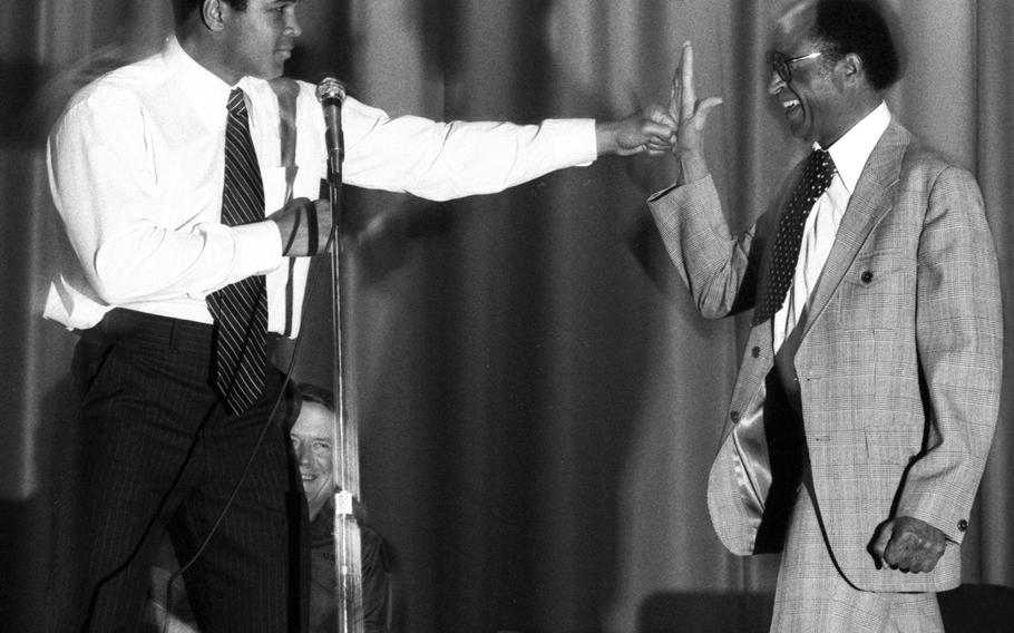 Ali throws a playful punch during a visit to Augsburg, West Germany, in May, 1976.