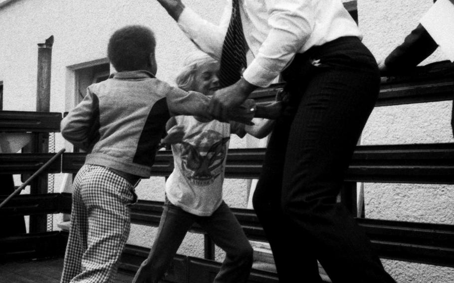 Muhammad Ali defends himself against the playful onslaught of Augsburg Elementary School pupils during a visit to Augsburg, West Germany, in May, 1976.