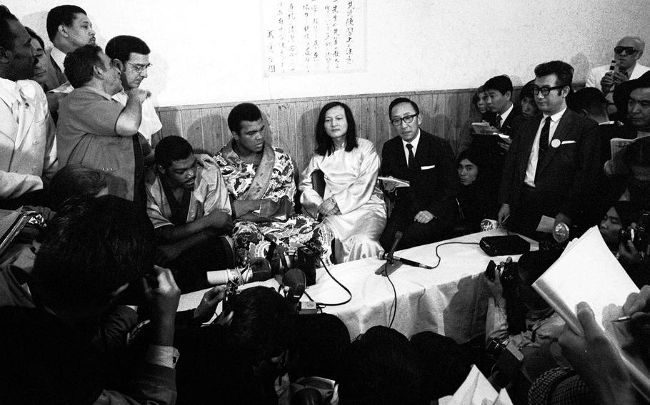 Muhammad Ali and Mac Foster meet with reporters after their fight in Tokyo in 1972. Ali beat Foster in 15 rounds.