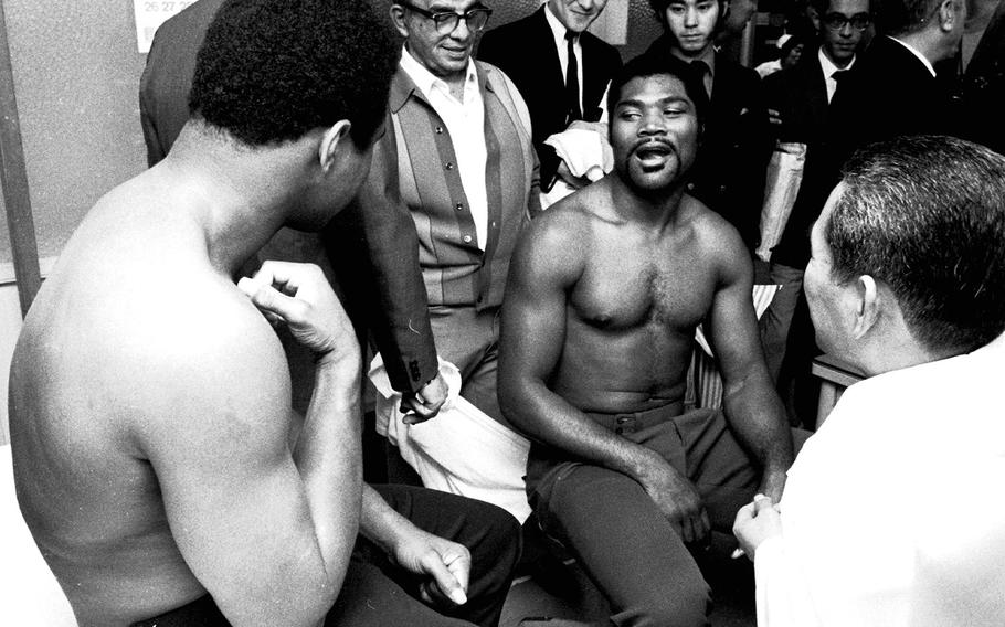 Muhammad Ali and Mac Foster, at the weigh-in for their upcoming fight in Tokyo in 1972. Ali beat Foster in 15 rounds.