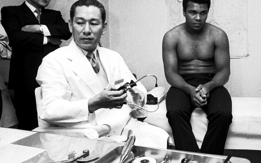 Muhammad Ali, at the weigh-in for his upcoming fight with Mac Foster in Tokyo in 1972. He beat Foster in 15 rounds.