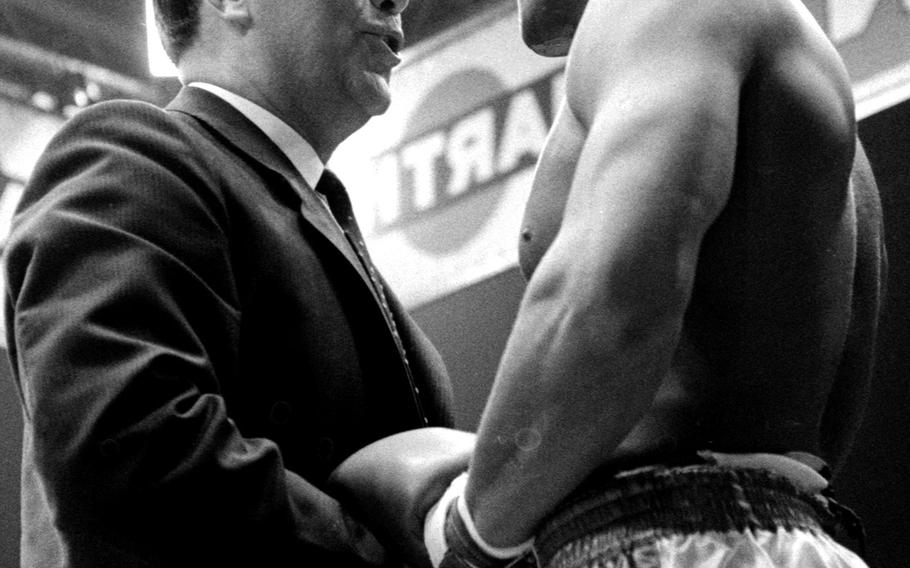 World heavyweight champion Muhammad Ali shakes hands with former champ Max Schmeling before battling European champ Karl Mildenberger at Frankfurt's Forest Stadium in September, 1966. Ali beat Mildenberger in 12 rounds, giving the 24-year-old his 26th win (without a loss) as a professional.