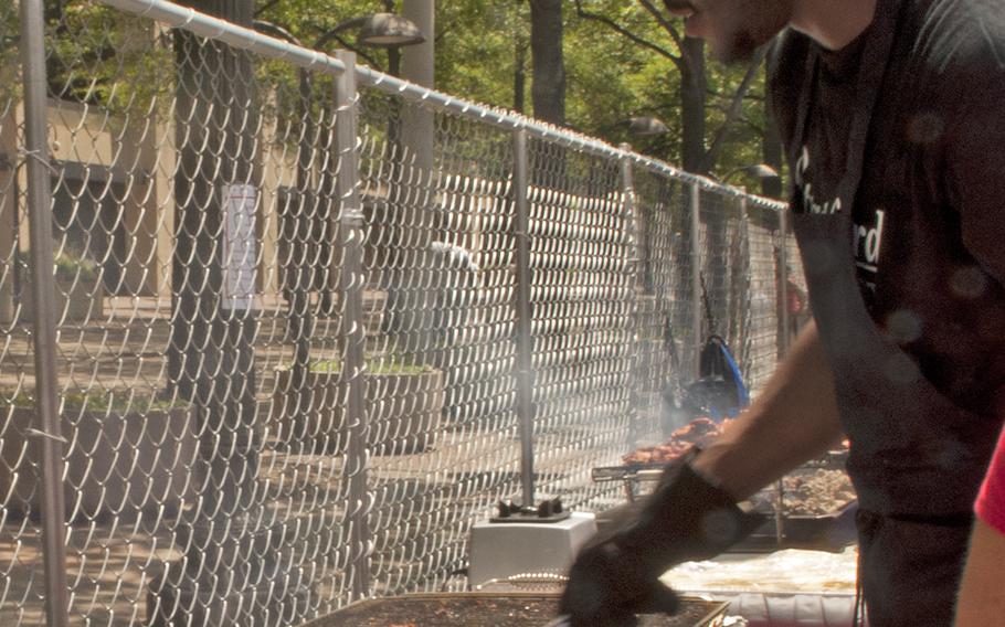 A chef grills some chicken during the Military Chef Cook-Off - part of the Annual Giant National Capital Barbecue Battle - in Washington, D.C., on June 25, 2016