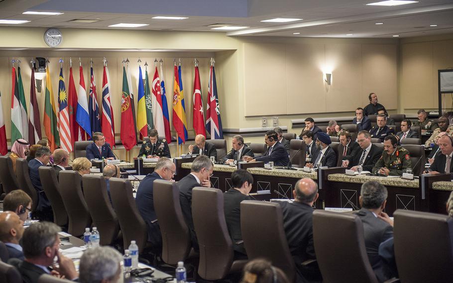 Secretary of Defense Ash Carter listens to remarks from French Minister of Defense Jean-Yves Le Drian during a meeting of defense ministers of the Global Coalition to Counter ISIL July 20, 2016, at Joint Base Andrews, Md. 