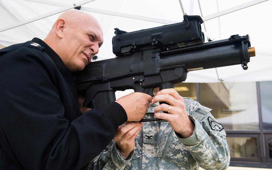 Then-Army Chief of Staff Gen. Ray Odierno looks through the sight of an XM25 Counter Defilade Target Engagement System during his visit to the Program Executive Office Soldier facility at Fort Belvoir, Va., on Nov 1, 2013.