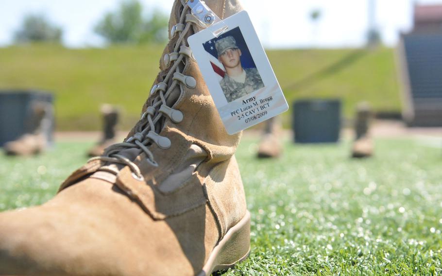 A memorial combat boot is displayed to represent one of fallen United States service members who are honored as part of a large memorial formation on May 17, 2016, at Fort Bragg, N.C.