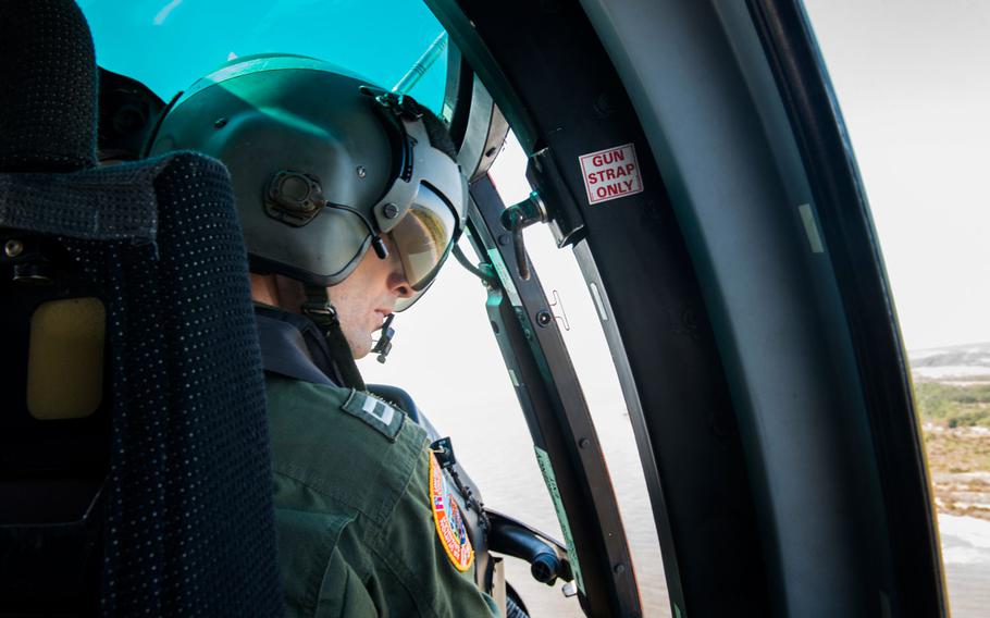 Lt. Eric Barnett, a helicopter pilot from Coast Guard Air Station Savannah, Georgia, conducts a post-storm damage assessment flight Saturday, Sept. 3, 2016, off the coast of Ossabaw Island, Georgia. The flight was conducted following Tropical Storm Hermine’s crossing over Georgia to evaluate the storm’s impact to the coastal areas.