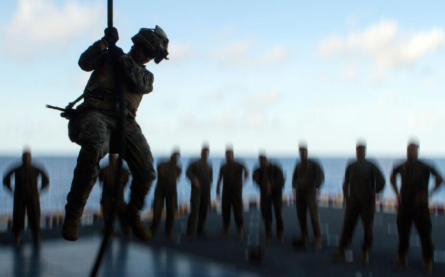 A Marine with Company E, Battalion Landing Team, 2nd Battalion, 4th Marines, fast-ropes toward an aircraft elevator during training at sea aboard the USS Bonhomme Richard (LHD-6), Sept. 3, 2016. Marines with BLT 2/4, and Combat Logistics Battalion 31, are currently embarked aboard the BHR during a regularly scheduled patrol of the Asia-Pacific region. The 31st MEU is the Marine Corps’ only continuously forward-deployed Marine Air-Ground Task Force, and combines air-ground-logistics into a single team capable of addressing a range of military operations in the Asia-Pacific region – from force projection and maritime security to humanitarian assistance and disaster relief in cooperation with host countries and partner militaries.