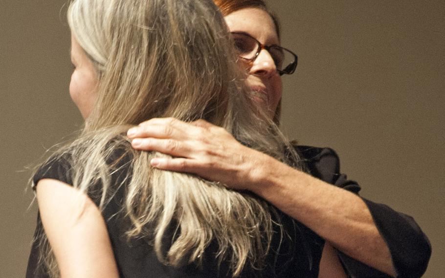 The funeral service for World War II WASP pilot Elaine Harmon at Arlington National Cemetery on Sept. 7, 2016. Erin Miller, the granddaughter of Harmon, embraces Rep. Martha McSally, R-Arizona after her remarks during the memorial service. 