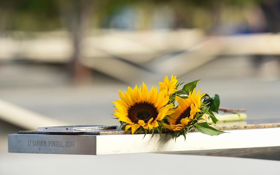Flowers rest on the memorial for fallen U.S. Navy Lt. Darin Pontell who died at the Pentagon in the 9/11 terrorist attacks in this Sept. 11, 2016 photograph taken during a ceremony marking the 15th anniversy of the attack. 