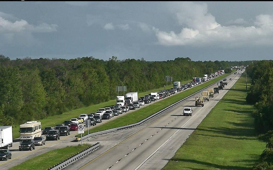 This photo from a Florida Department of Transportation traffic camera, which has become a hit on the internet, shows National Guard vehicles heading south to prepare to help residents in Hurricane Matthew's wake as evacuees move in the opposite direction.