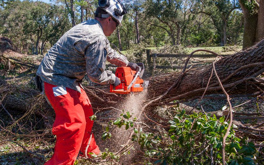 U.S. Army Sgt. Matthew McHenry with the 125th Multi-Role Bridge Company (MRBC), for the S.C. Army National Guard, uses a chainsaw to remove fallen trees along U.S. Highway 278 in Hilton Head Island, Oct. 9, 2016.  Hurricane Matthew peaked as a Category 4 hurricane in the Caribbean and passed over the southeastern U.S., including the S.C. coast. Approximately 2,800 S.C. National Guard Soldiers and Airmen have been activated since Oct. 4, 2016, to support state and county emergency management agencies and local first responders after Governor Nikki Haley declared a State of Emergency.