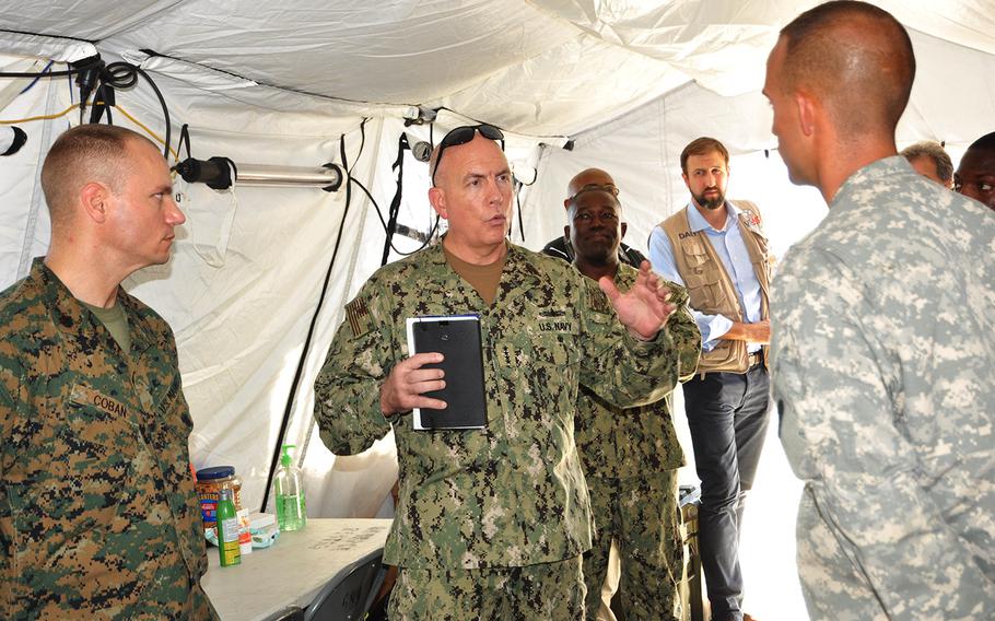 Adm. Kurt Tidd, Commander of U.S. Southern Command, meets with Marines from the Marine Air-Ground Task Force on Oct. 15 during a visit to U.S. troops in the Haitian capital Port-au-Prince assisting in hurricane relief efforts. A joint task force of the U.S. military has been operating out of the international airport in the capital, helping to load and deliver USAID relief supplies by helicopters to the worst stricken areas in the country’s southwest.