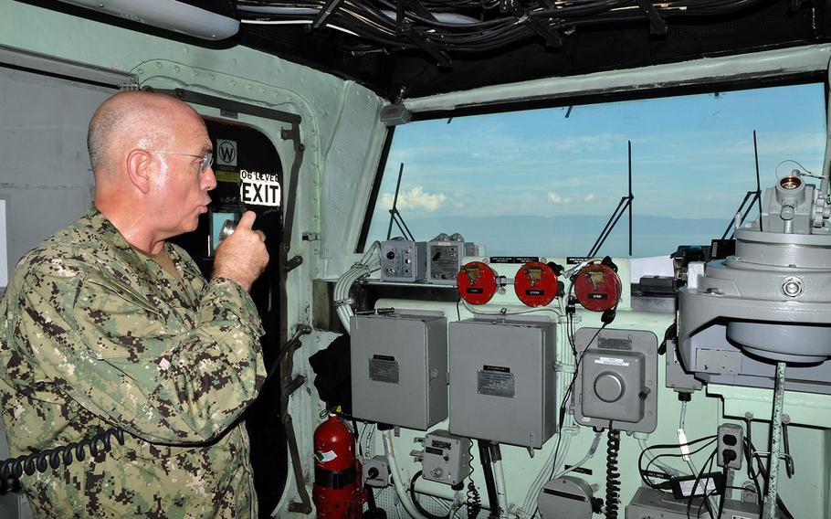 Adm. Kurt Tidd, Commander of U.S. Southern Command, addresses sailors and Marines from the bridge of the amphibious assault ship Iwo Jima, which arrived off the coast of Haiti on Oct. 13 and will assume the lead in  military assistance for Hurricane Matthew relief efforts.