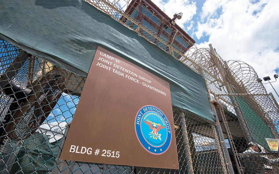 A U.S. soldier opens a gate outside Camp VI at Guantanamo Bay, Cuba in this April 19, 2016 photo.