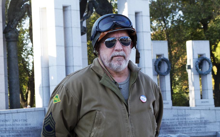 John Liszewski, dressed as a WWII tank commander, waits for the start of the World War II Memorial Veterans Day service on Nov. 11, 2016. 
