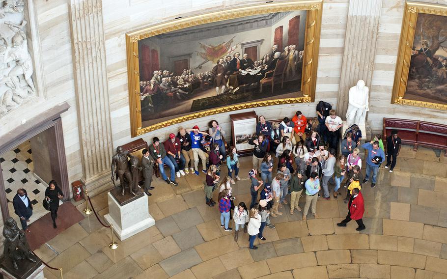 Visitors in the Capitol rotunda, from the peristyle level of the dome.