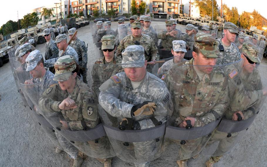 Members of the 270th and 649th Military Police Companies, 49th Military Police Brigade, California Army National Guard, move into formation during an exercise at the Federal Emergency Management Agency Headquarters, California Task Force I, Los Angeles. 
