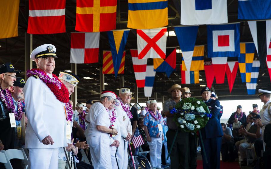 
Retired Navy Lt. Cmdr. Lou Conter, left, beams during the Pacific Fleet Band's rendition of "Anchors Aweigh" during the 75th anniversary commemoration of the attack on Pearl Harbor, Wednesday, Dec. 7, 2016, at Joint Base Pearl Harbor-Hickam, Hawaii.
