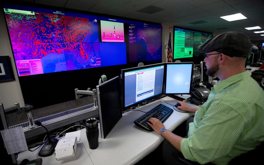 In this Sept. 9, 2014, file photo, a specialist works at the National Cybersecurity and Communications Integration Center (NCCIC) in Arlington, Va.