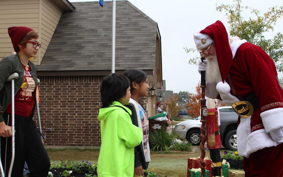 The Martinez children meet Santa Claus on Dec. 17, 2016. The nonprofit Building Homes for Heroes donated a mortgage-free house and provided Christmas decorations for the family, along with gifts from Santa and a visit to Disneyworld. Air Force Lt. Col. Kato Martinez's wife Gail was killed in a suicide bombing in the Brussels Airport on March 22, 2016. Martinez was wounded along with all four children, who sustained burns, fractures and other injuries.