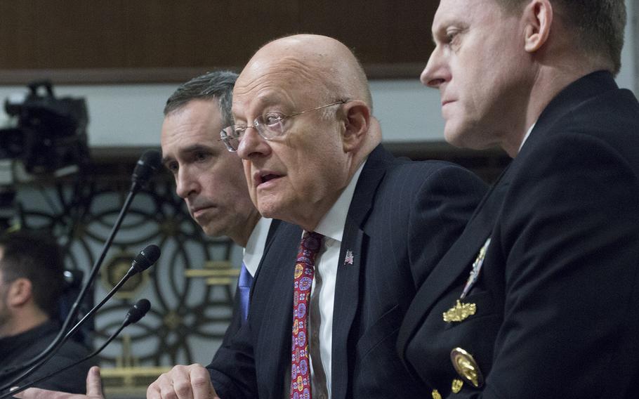 Director of National Intelligence James R. Clapper, Jr., center, makes a point during a Senate Armed Services Committee hearing on cybersecurity, Jan. 5, 2017, on Capitol Hill. To his right is Under Secretary of Defense for Intelligence Marcel J. Lettre II, and to his left National Security Agency Director Adm. Michael S. Rogers.